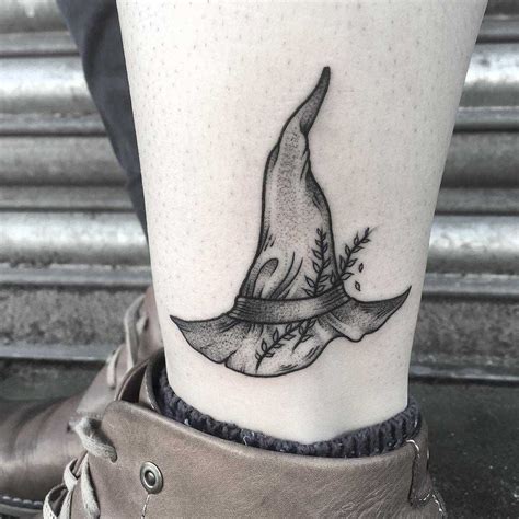 simple witch hat tattoo